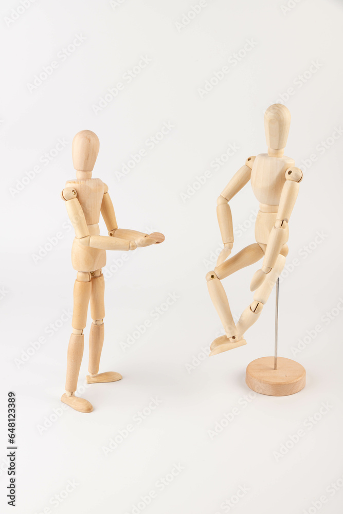 two wooden figures of people communicate emotionally. two wooden figures of people communicate emotionally.