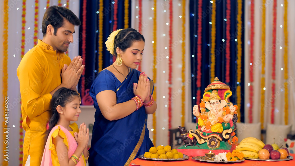 A Modern Indian Family Prays To Lord Ganesh On Ganesh Chaturthi a-modern-indian-family-prays-to-lord-ganesh-on-ganesh-chaturthi