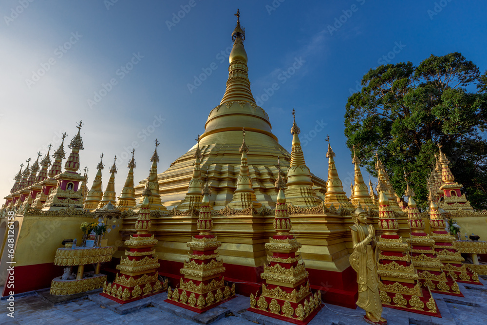 Fototapeta premium background of the pagoda(Wat Suwan Khiri),Phutthasuwan Chedi, built for people or tourists to come to make merit and take pictures without having to seek permission while traveling in Ranong,Thailand.