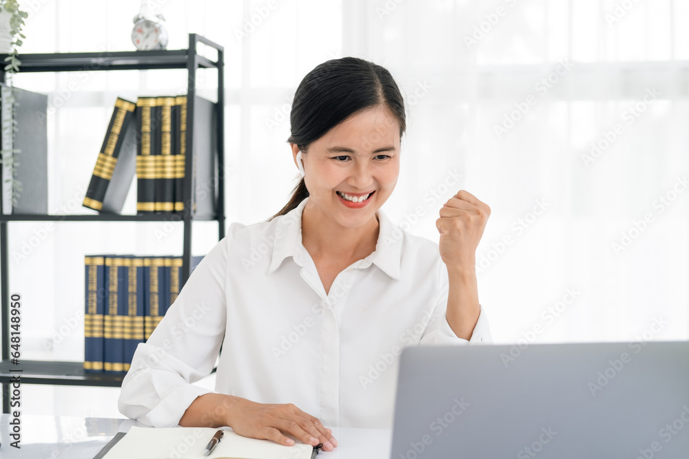 Successful business woman with arms up - isolated over a white office background Successful business woman with arms up - isolated over a white office background