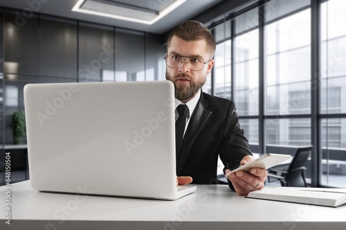 Young businessman using a computer in office, AI generated image