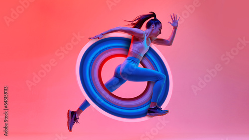 Young girl, athlete, runner in motion, training over pink studio background in neon light with abstract element. Contemporary art collage. Concept of sport, creativity, action and motion, health.