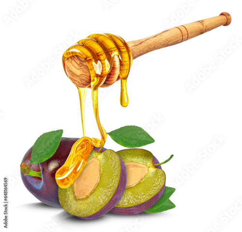 dripping honey on plums isolated on white background