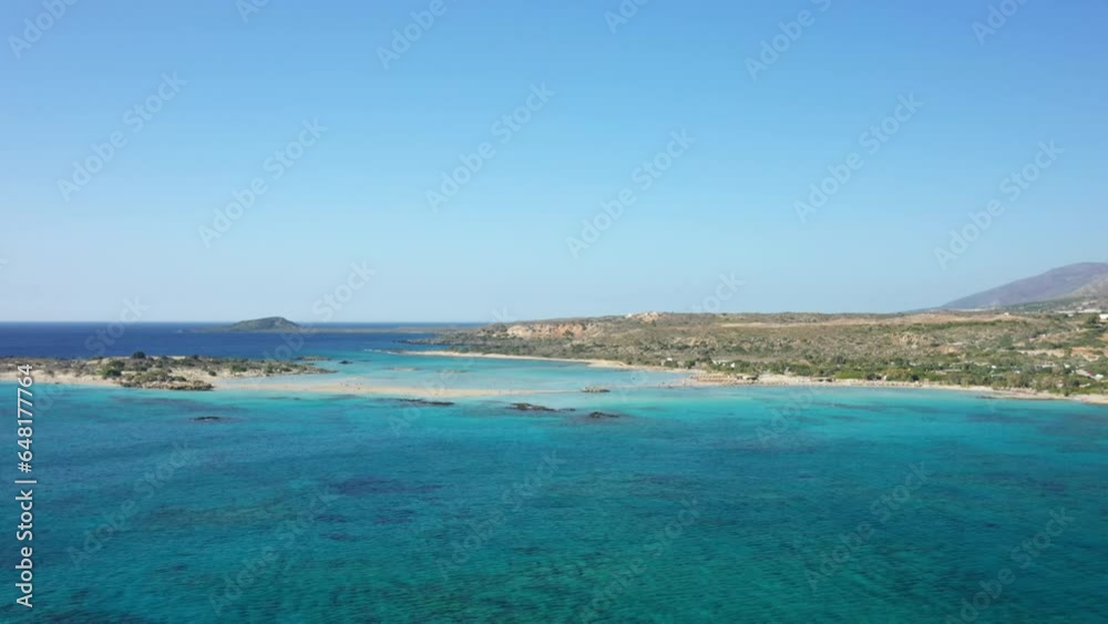 The soft sandy coastline and its postcard-colored waters, in Europe, in Greece, in Crete, in Elafonisi, By the Mediterranean Sea, in summer, on a sunny day. The soft sandy coastline and its postcard-colored waters, in Europe, in Greece, in Crete, in Elafonisi, By the Mediterranean Sea, in summer, on a sunny day.