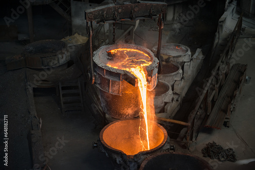 Tank pours liquid metal at the steel mill
