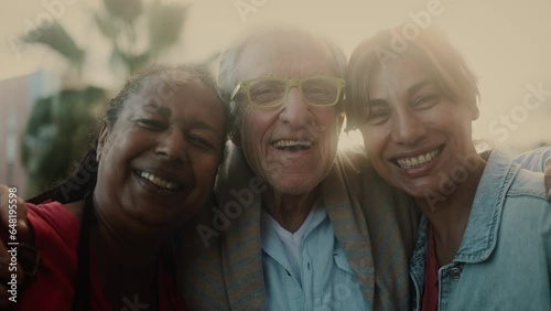 Happy multiracial people with diverse age having fun smiling in front of camera outdoor