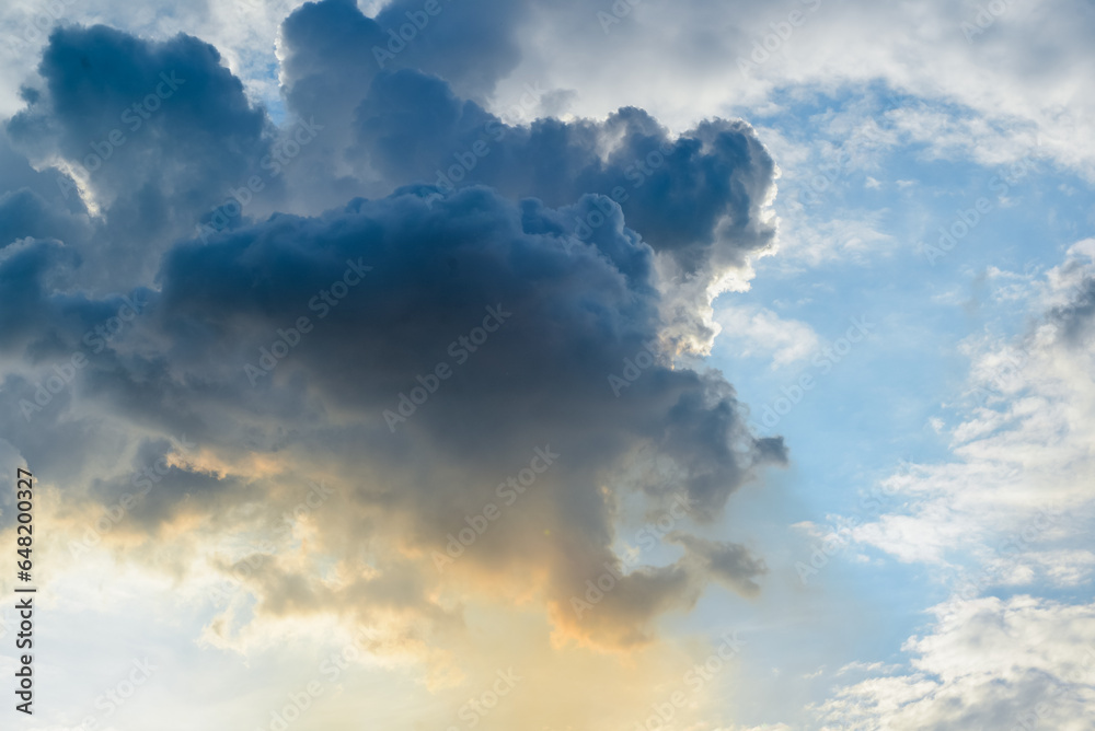 Fototapeta premium Beautiful clouds formations hover with sunlight reflections