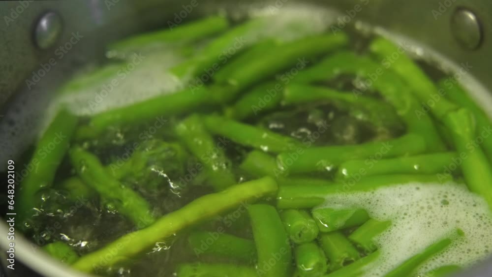 Boiled yardlong beans, Vigna sinensis steaming in a saucepan. Pan of green beans cooking. Steamed kidney beans Boil on Cooktop in boiling water. Many bubbles. Edamame, soy. French piattoni beans
Boiled yardlong beans, Vigna sinensis steaming in a saucepan. Pan of green beans cooking. Steamed kidney beans Boil on Cooktop in boiling water. Many bubbles. Edamame, soy. French piattoni beans