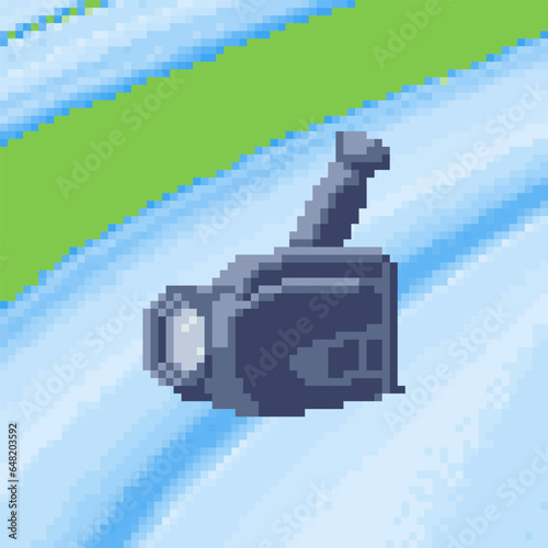 Pixel art cassette tape video camera recorder. Old camcorder vector icon in retro video game style.