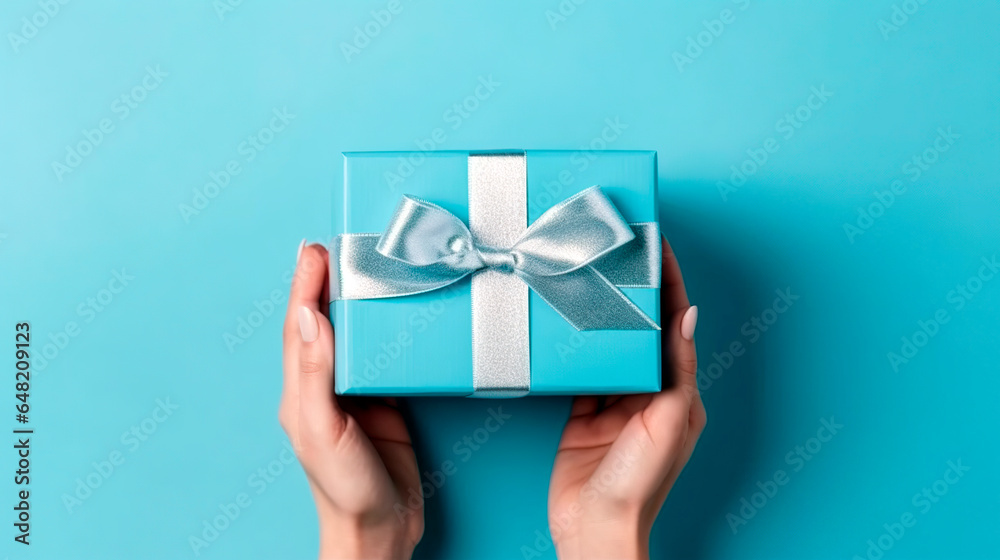 person holding a gift box person holding a gift box