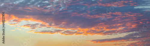 Panoramic idyllic sky scenery with colorful clouds in blurred depth of field