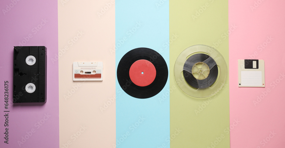 Floppy disk, vinyl record, film reel, vhs and audio cassette on a