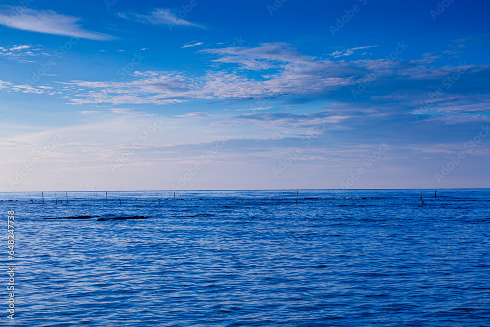 Obraz premium sea and sky,Calm sea and blue sky background.