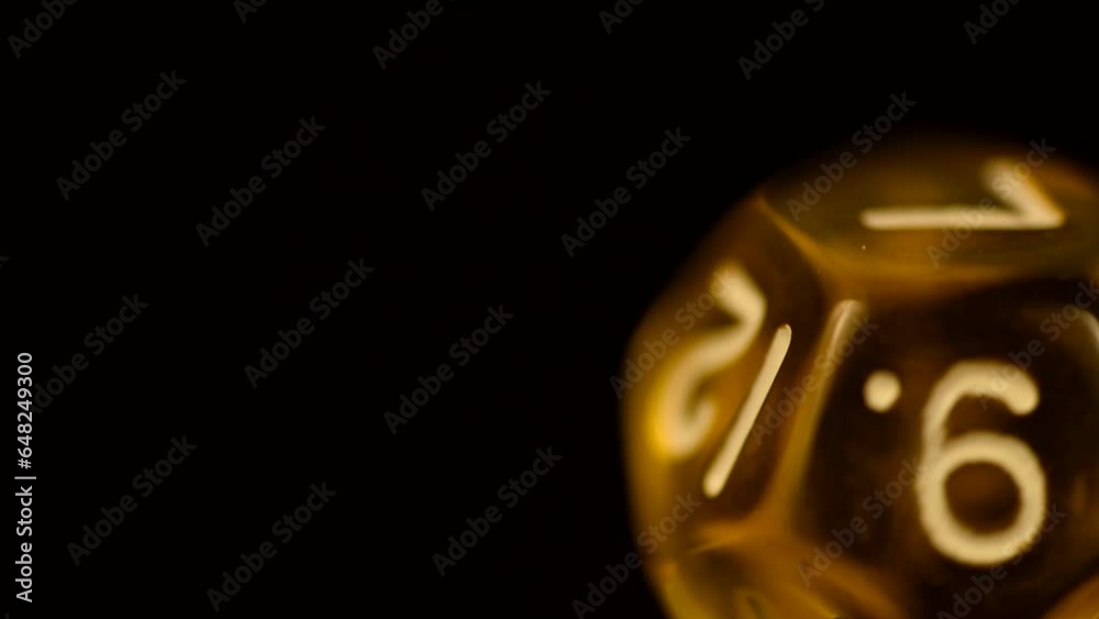 Yellow d12 tabletop board game die rotating gamer close-up footage dice Yellow d12 tabletop board game die rotating gamer close-up footage dice