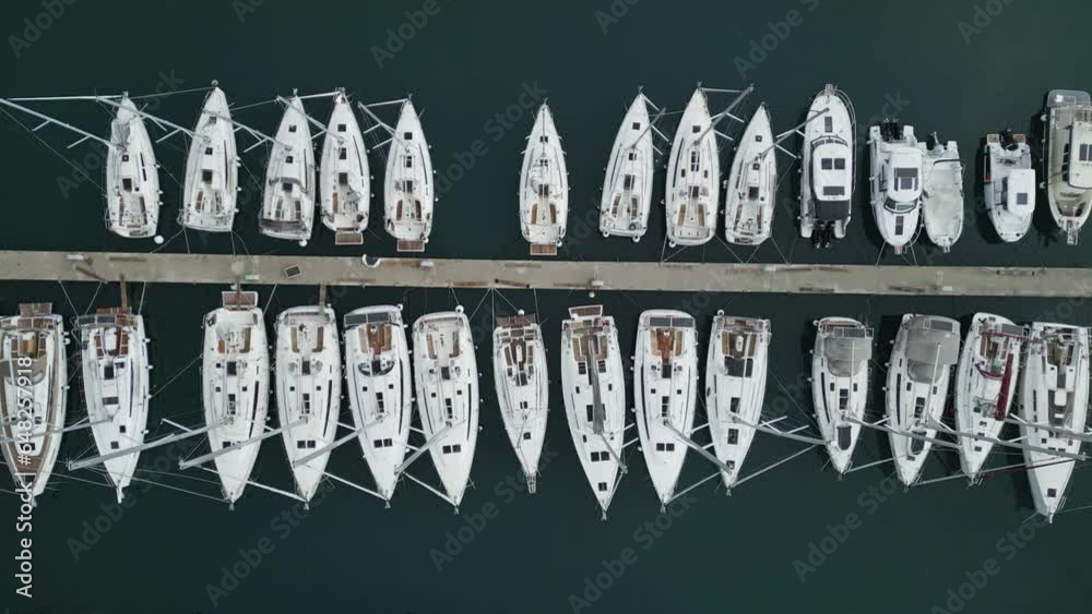 Aerial top view on the luxury yachts and boats in marina, 4k