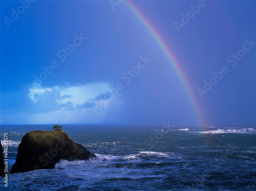 A Rainbow Brightens The Sky Over The Ocean; Charleston, Oregon, United States Of America