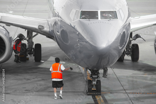 Arriving airplane on tarmac ready to off-load passengers and receive maintenance