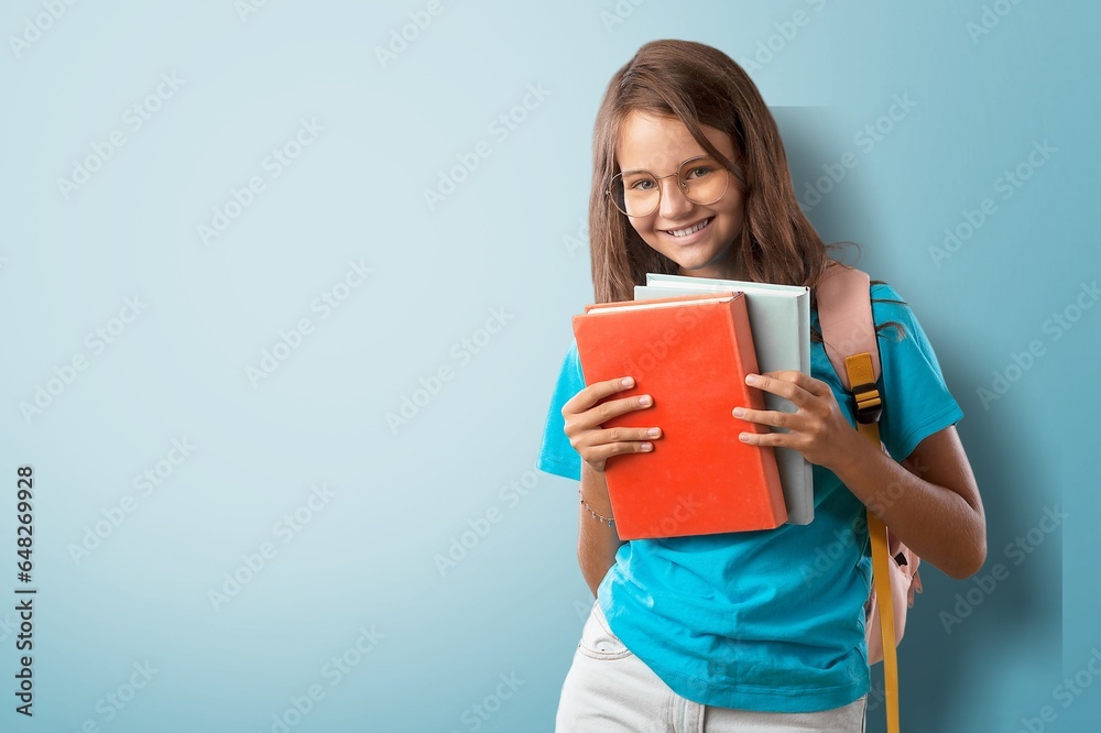 Happy small Student holding notebooks. Happy small Student holding notebooks.