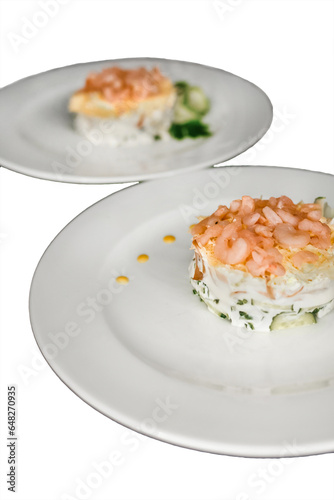 Beautiful serving dish salad under the crooks and garnished with herbs on a 2 two white plate food restaurant on a isolated background