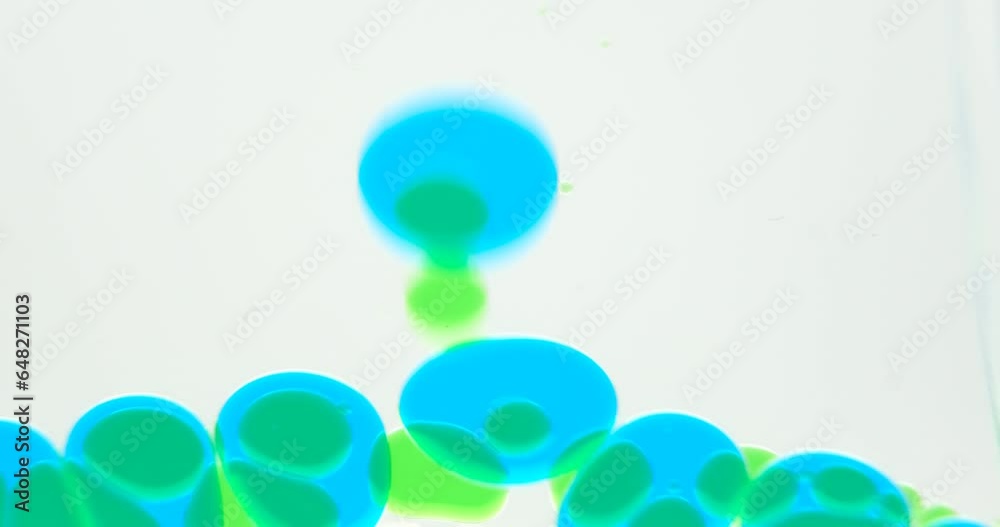 Close up of various sizes of transparent liquid bubbles floating down Close up of various sizes of transparent liquid bubbles floating down