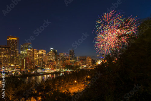 North American City Skyline At Night, With Skyscrapers And Fireworks; Calgary, Alberta, Canada photo