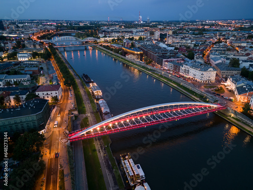Krakow, Poland, aerial view of the Kazimierz and Podgorze districts with Vistula river bridges in the night