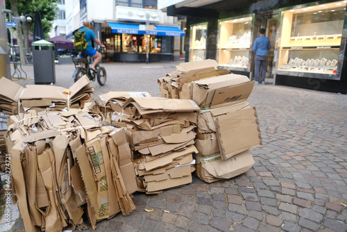 waste paper collection for processing, box with cardboard packages on street, sheets of used paper for recycling, pulp recycling, Sustainable Packaging and Waste Reduction photo