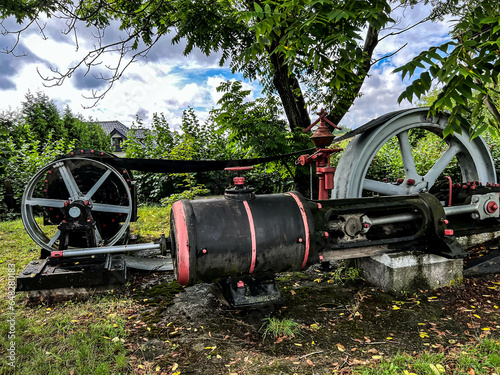 An exhibition of old steam engines on the square next to the historic stebra mine in Tarnowskie Góry. A steam engine driving a suction fan in a coking plant.