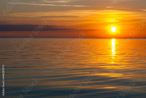 Sunset on the Volga. The background image is in orange-brown tones. © tinkerfrost