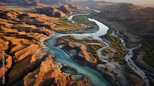 Aerial View of a Meandering River in Rugged Landscape
