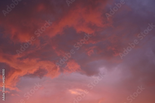 pink blue rainy clouds against the background of the winter sky illuminated by the rays of the sun, evening sunset, rays of the sun through cirrus pink clouds against the background of the sunset sky, © Анна Климчук