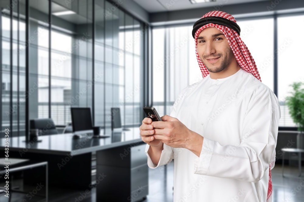 Happy young Arab business man at office, AI generated image Happy young Arab business man at office, AI generated image