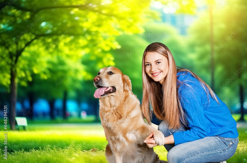Happy woman playing with cute dog
