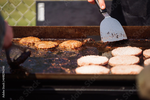 Flipping Burger Patties on a Flat Top Grill 2