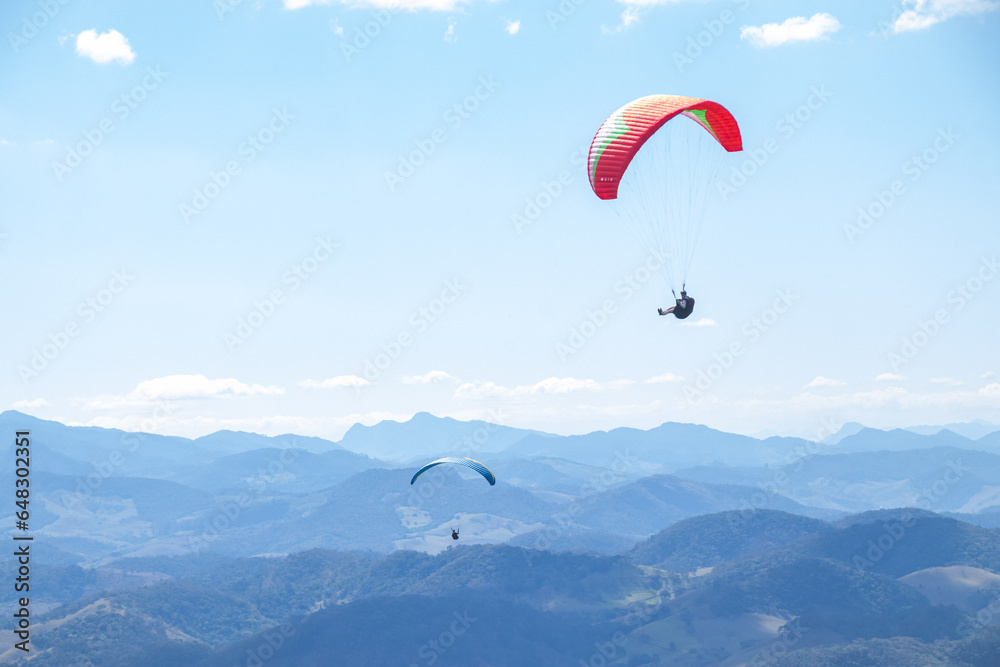 paragliders in the sky over the mountains paragliders in the sky over the mountains