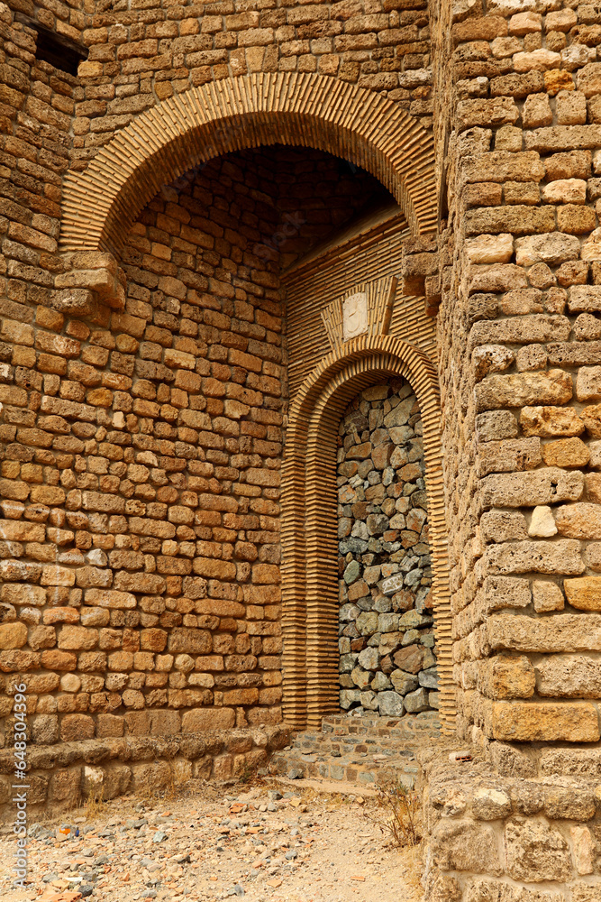 Tower of an abandoned castle made out of stones 