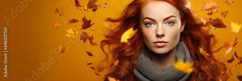 Portrait of a woman in over autumn leaf background © adam