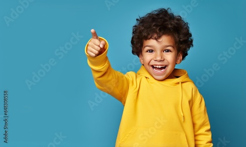 Isolated Man pointing Over Blue Background