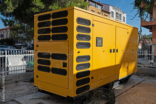 Obraz na płótnie Large generator in yellow colour.