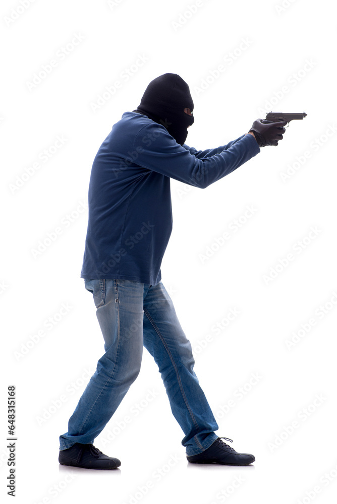 Young male burglar holding handgun isolated on white