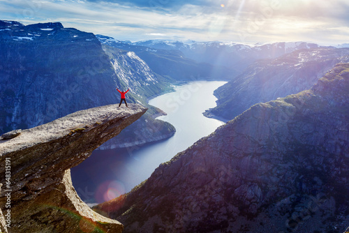 Woman jamping on Trolltunga in Norway 