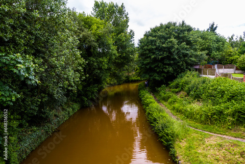 Shady part of the Orange coloured canal from clay in tunnel, The Trent and Mersey Canal. photo