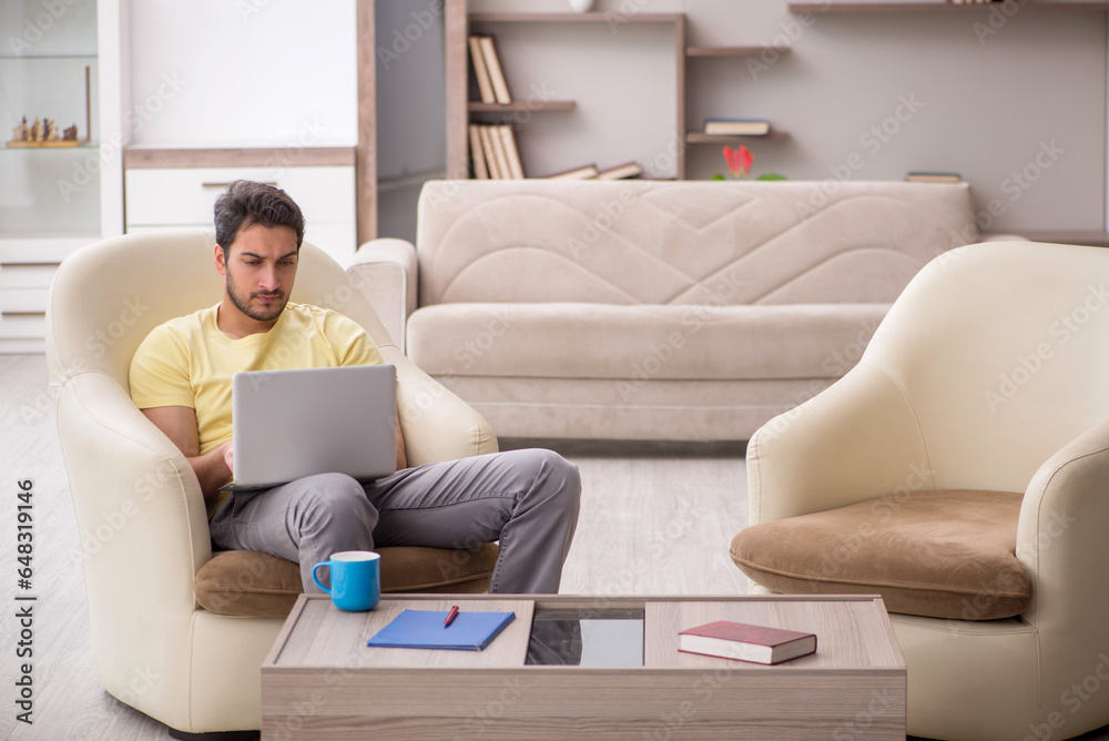 Young man working from home during pandemic Young man working from home during pandemic