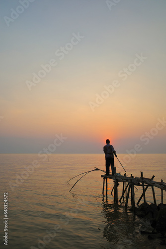 fishermen looking for fish on the beach