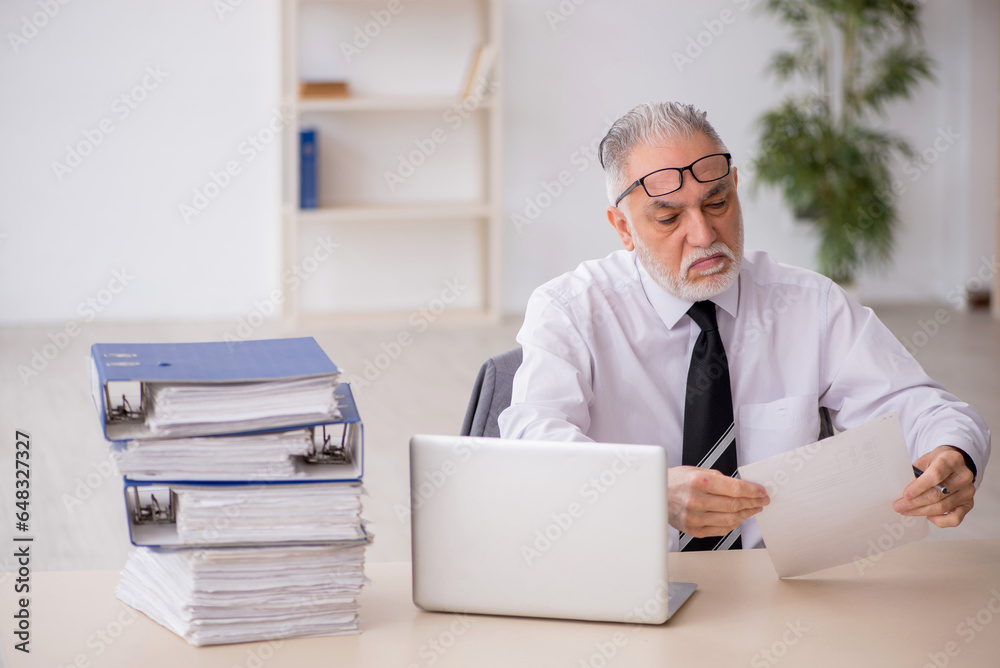 Old male employee and too much work in the office