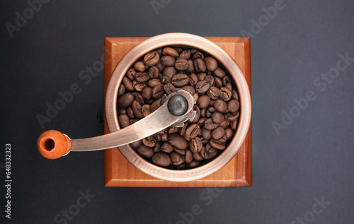 Photo of classic coffee grinder and coffee beans. photo