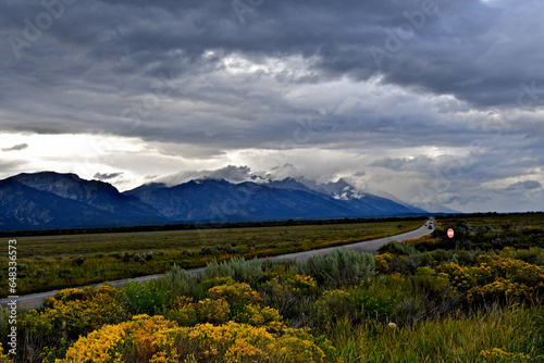 View up Snake River Valley and Scenic Highway 191. Storm clouds above the Tetons, Wyoming  © John Nakata