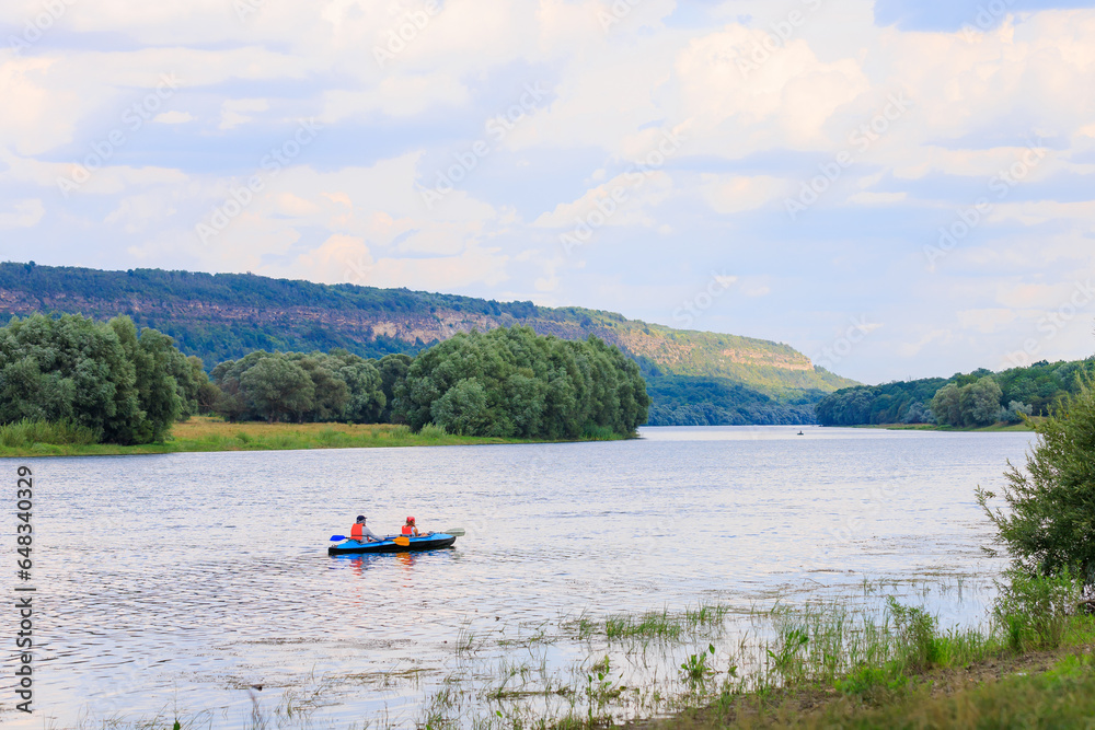 People travel along the river in a kayak. Rafting as a healthy lifestyle. Background