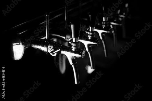 Beer silver taps kegerator object on a black background photo