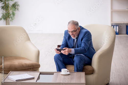 Old businessman waiting for business meeting